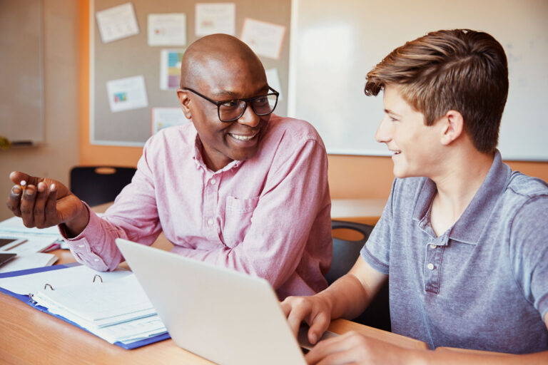 Teacher teaching a male student